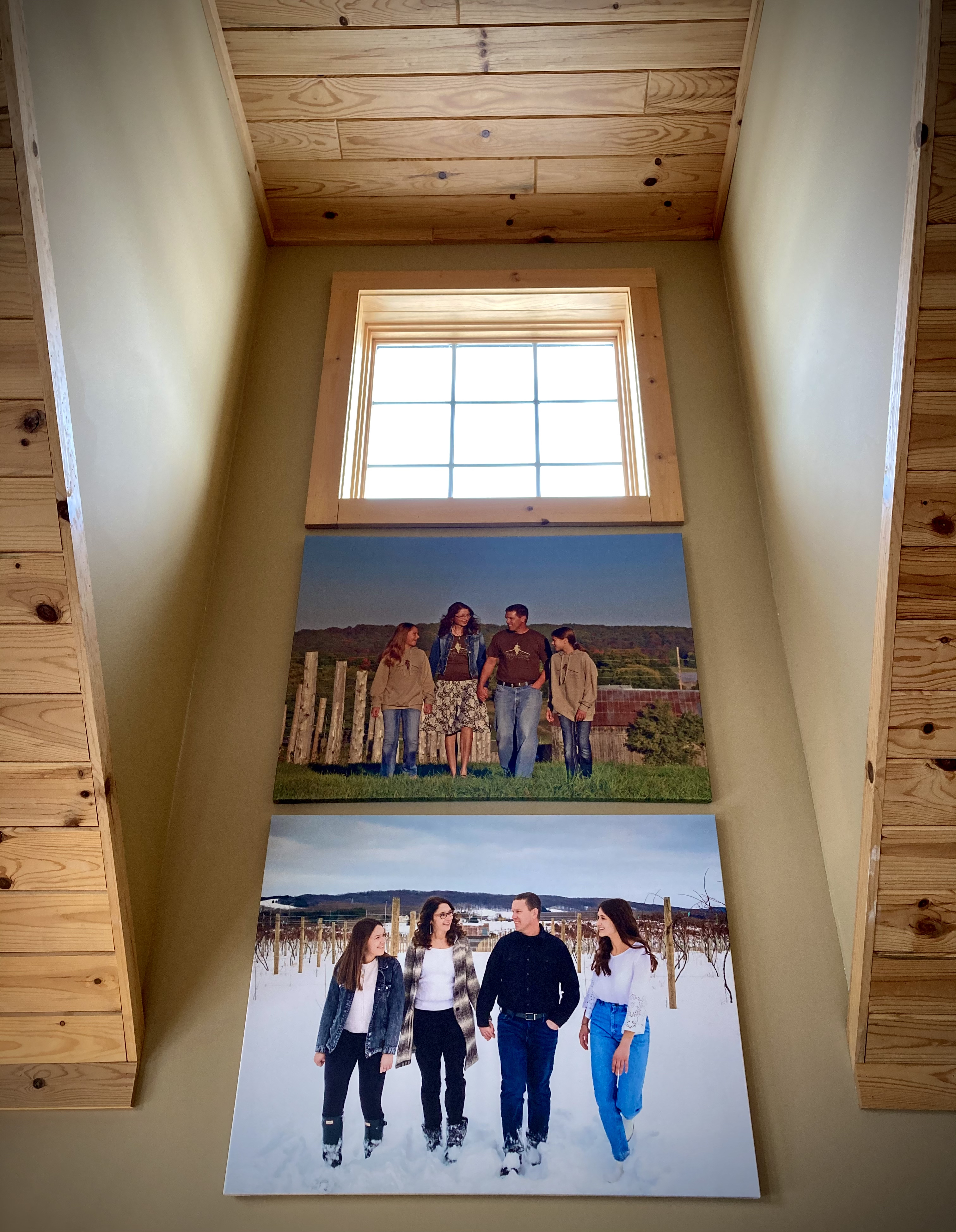 Two canvas photos of the Roush family, one from 2014 and one from 2022.